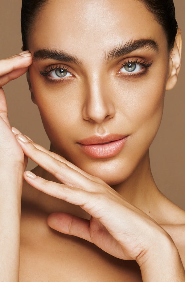 Close-up of a woman's face with a neutral background